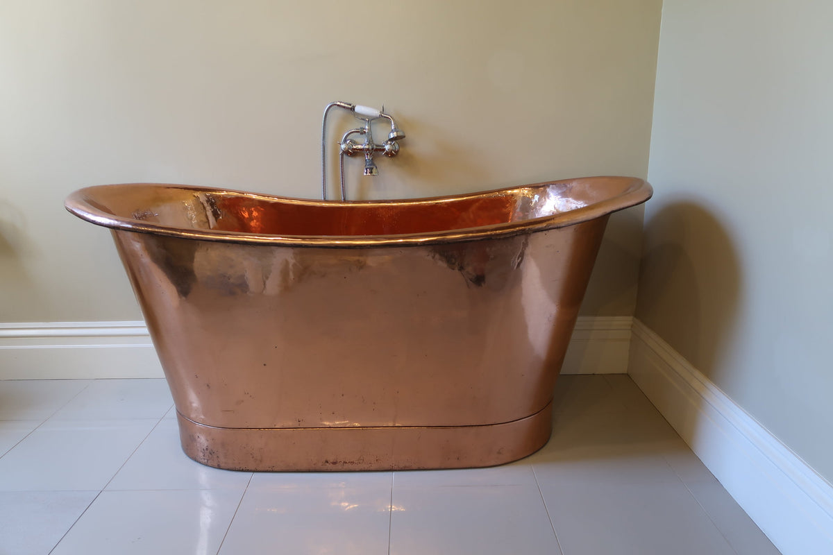 Close-up of the copper bath in Sister Leone's room, showcasing its elegant design and polished finish, adding a touch of luxury and sophistication to the space.